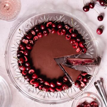 cherry chocolate black forest cheesecake on a big plate