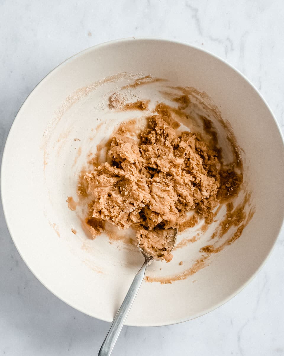 all ingredients for 3 ingredient peanutbutter cookies mixed together in a big bowl