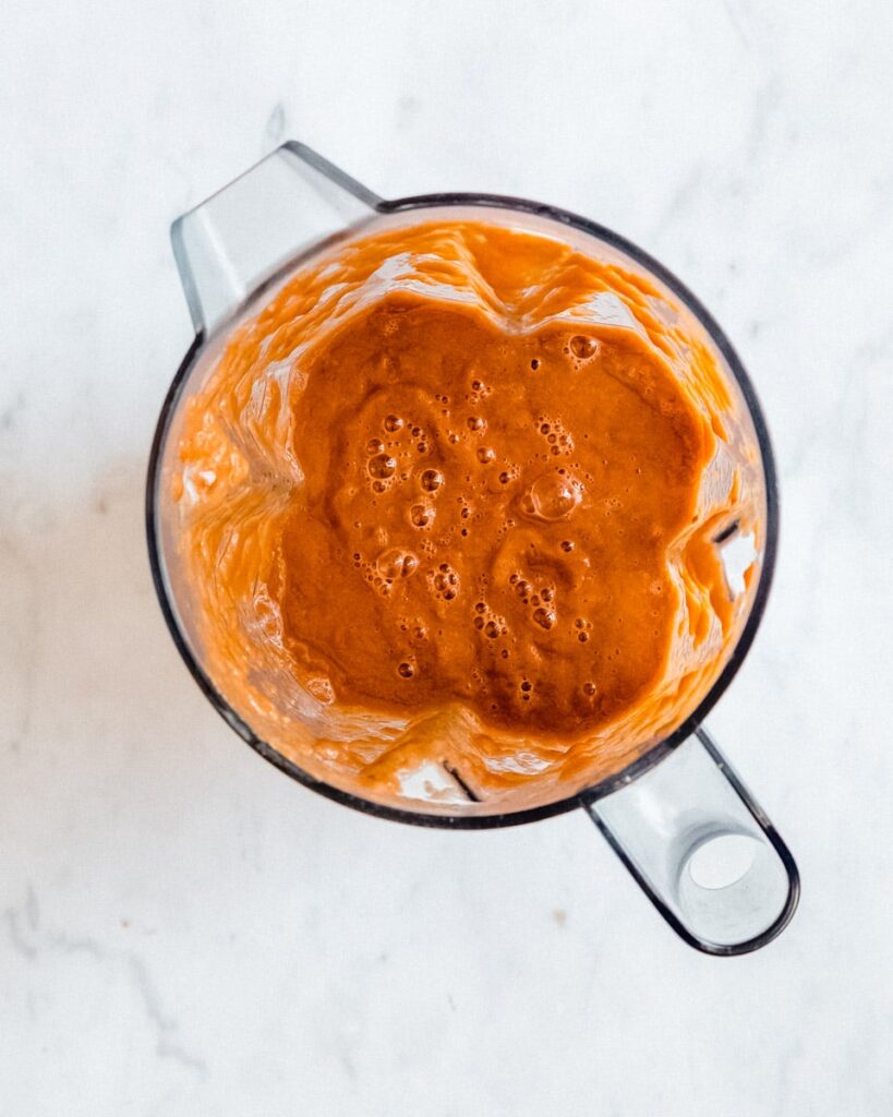pureed tomato soup in a blender