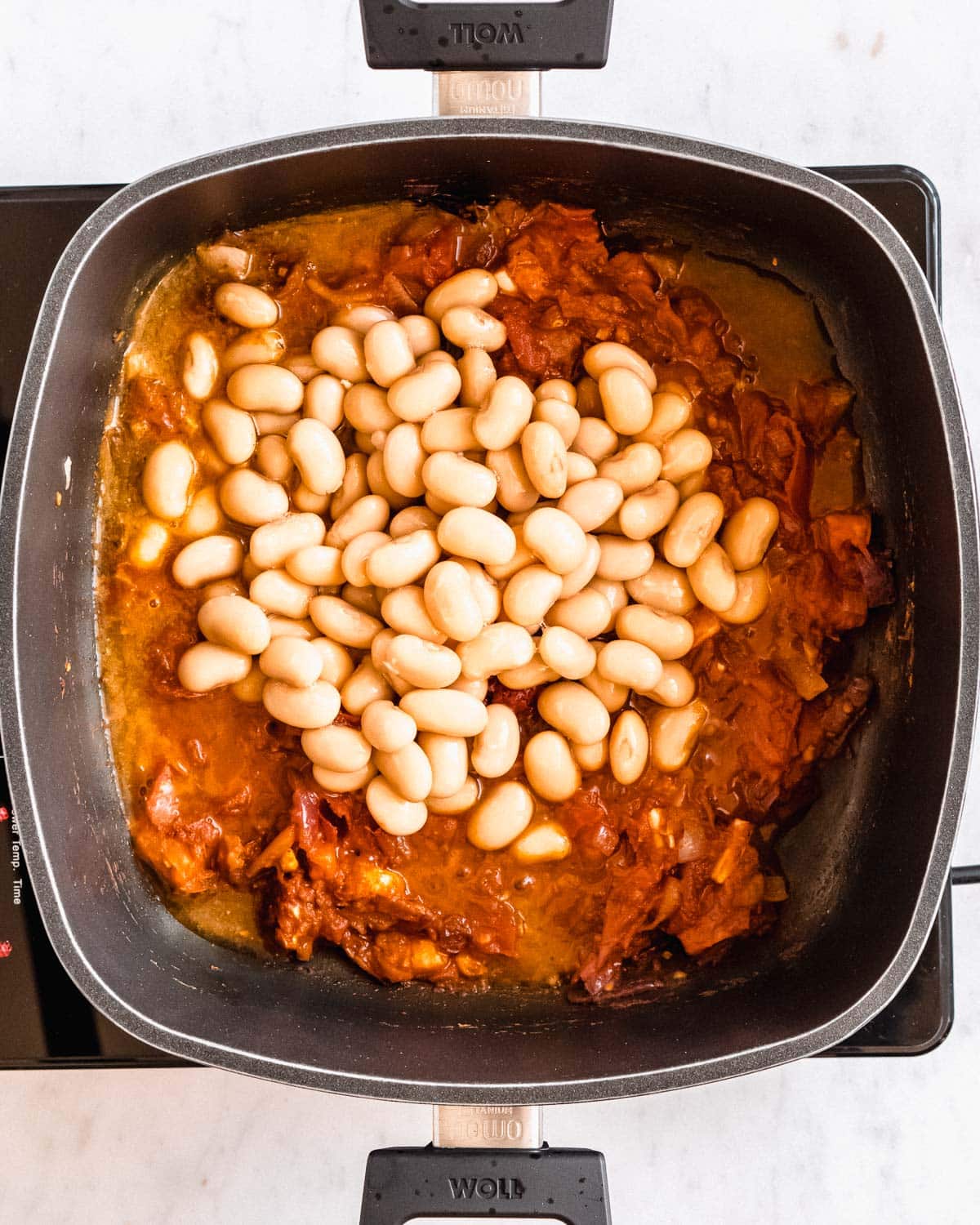 canned white beans added to the cooked tomato mix.