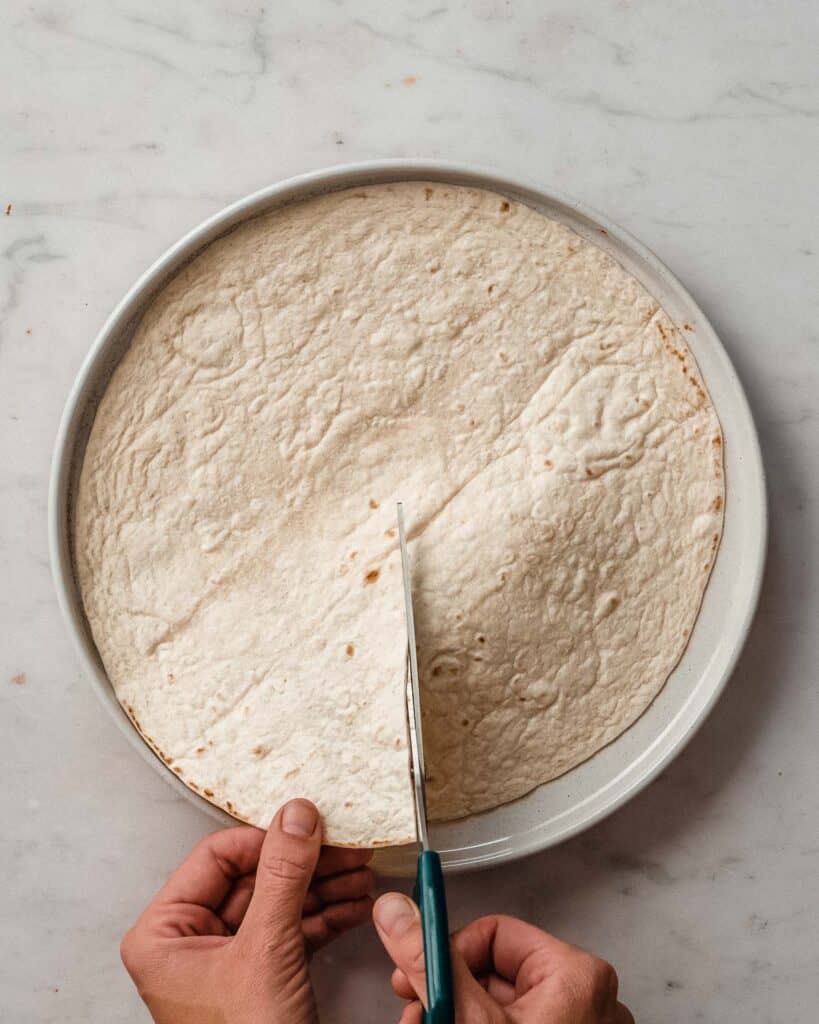 cutting tortilla open until the middle.