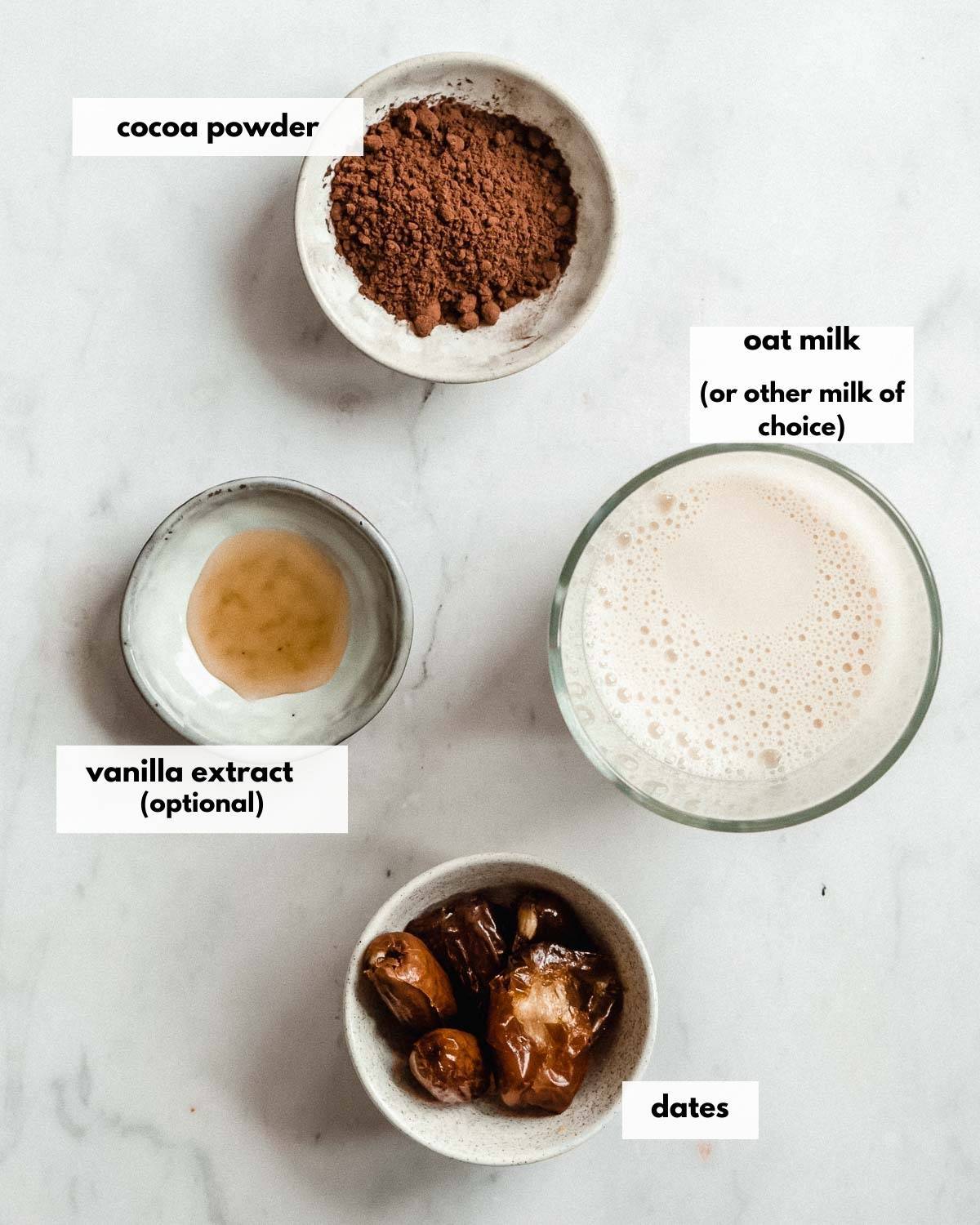 all ingredients needed to make healthy chocolate milk with cocoa powder.