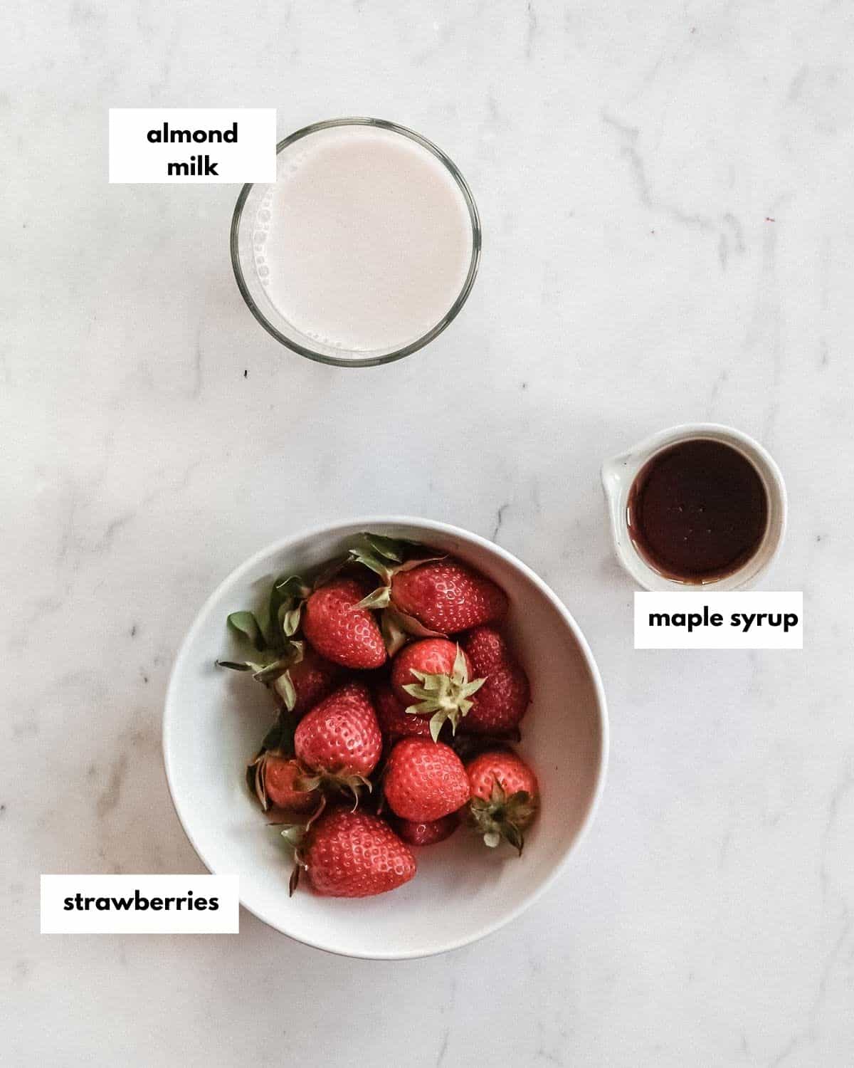 all ingredients needed to make strawberry almond milk.