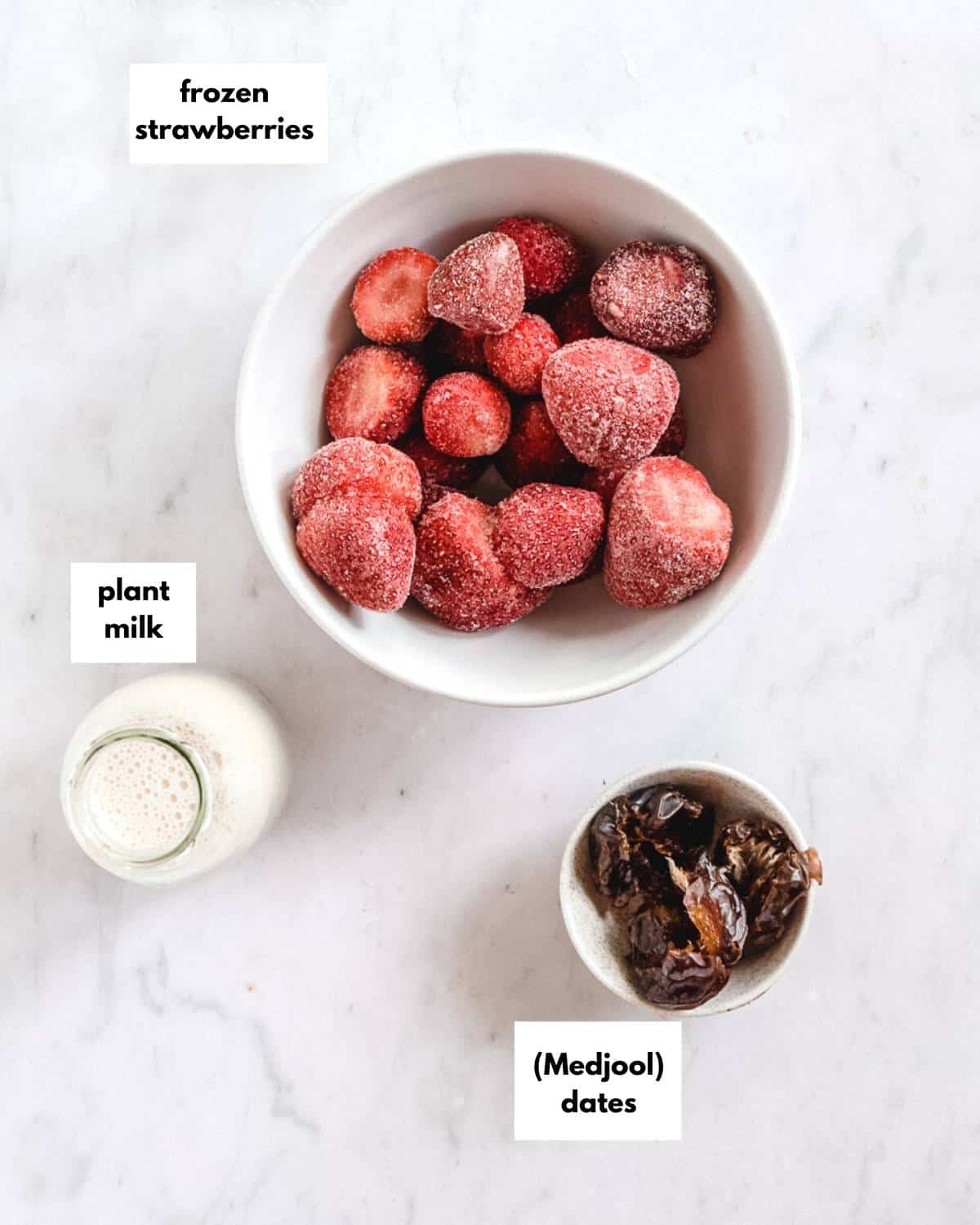 all ingredients for strawberry almond milkshake.