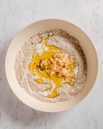 dry ingredients and wet ingredients in a mixing bowl.
