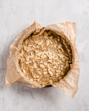almond cake mixture in a cake tin.