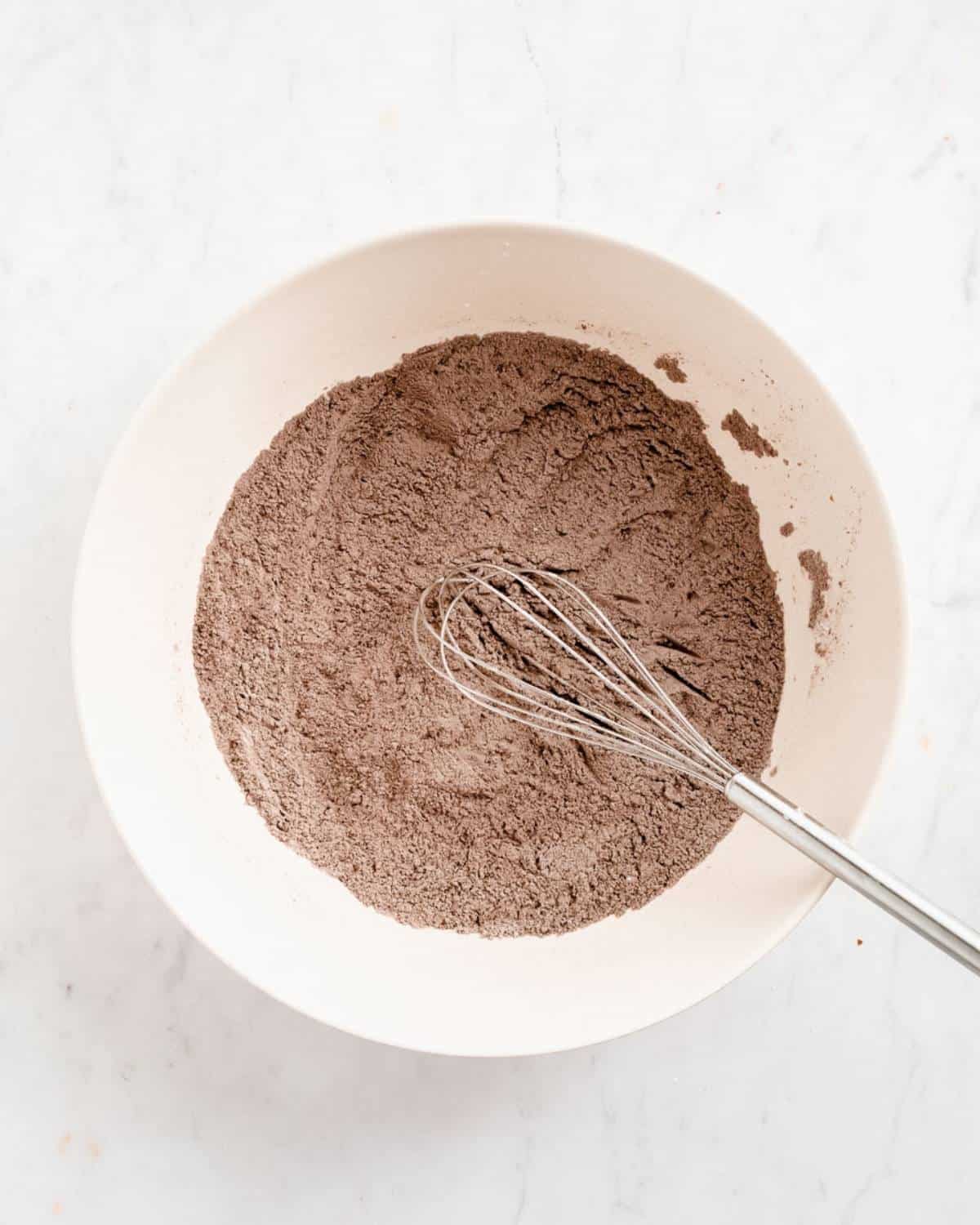 flour, cocoa powder, baking powder, salt, pumpkin pie spice in a big mixing bowl whisked together.