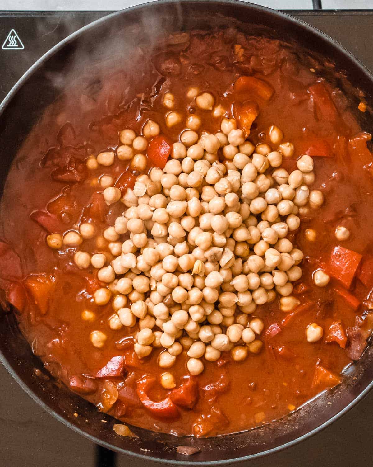 chickpeas added to the pan.