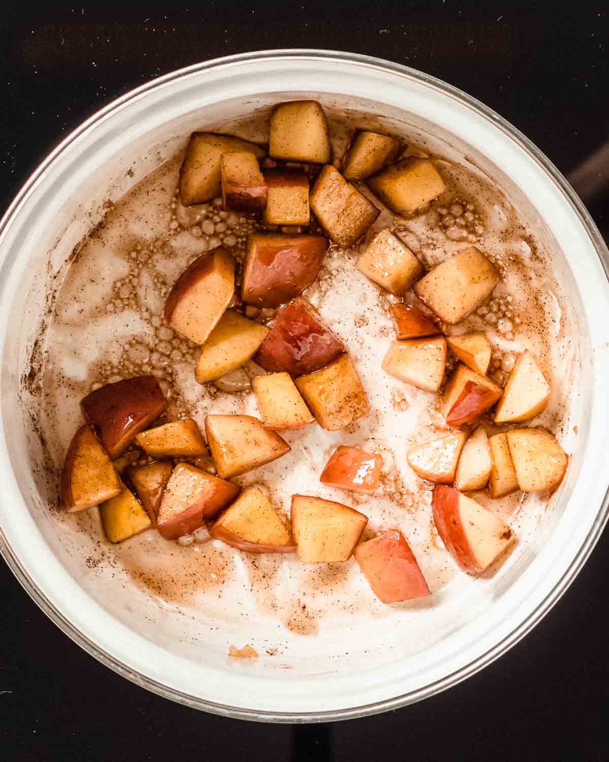 caramelized diced apples in a saucepan.