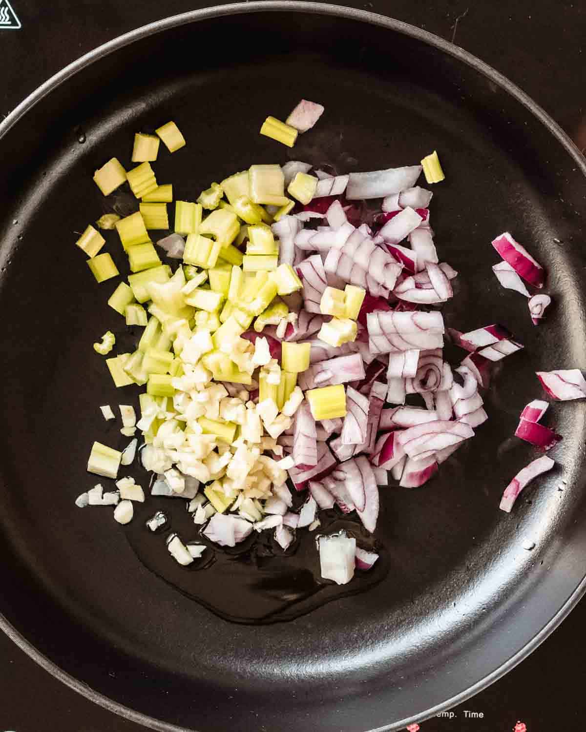 chopped onion, garlic and celery with some olive oil in a pan.