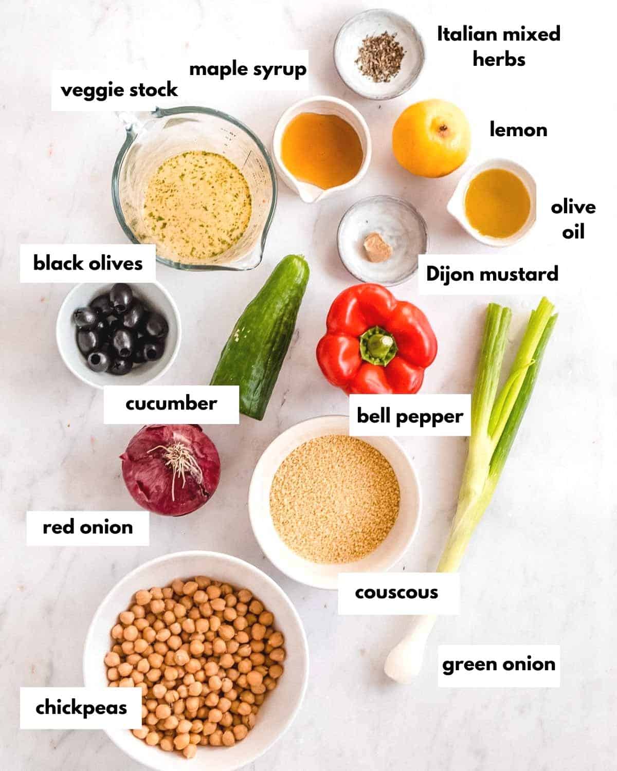 all ingredients for vegan couscous salad laid out on a table.