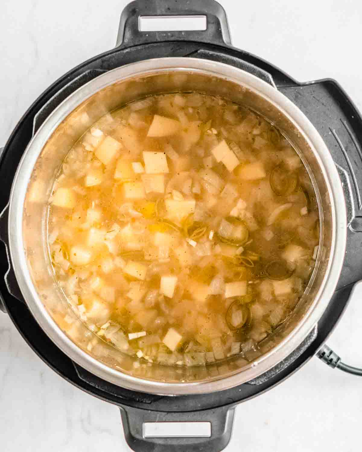potato soup in the instant pot that has been cooked for 10 minutes on high pressure