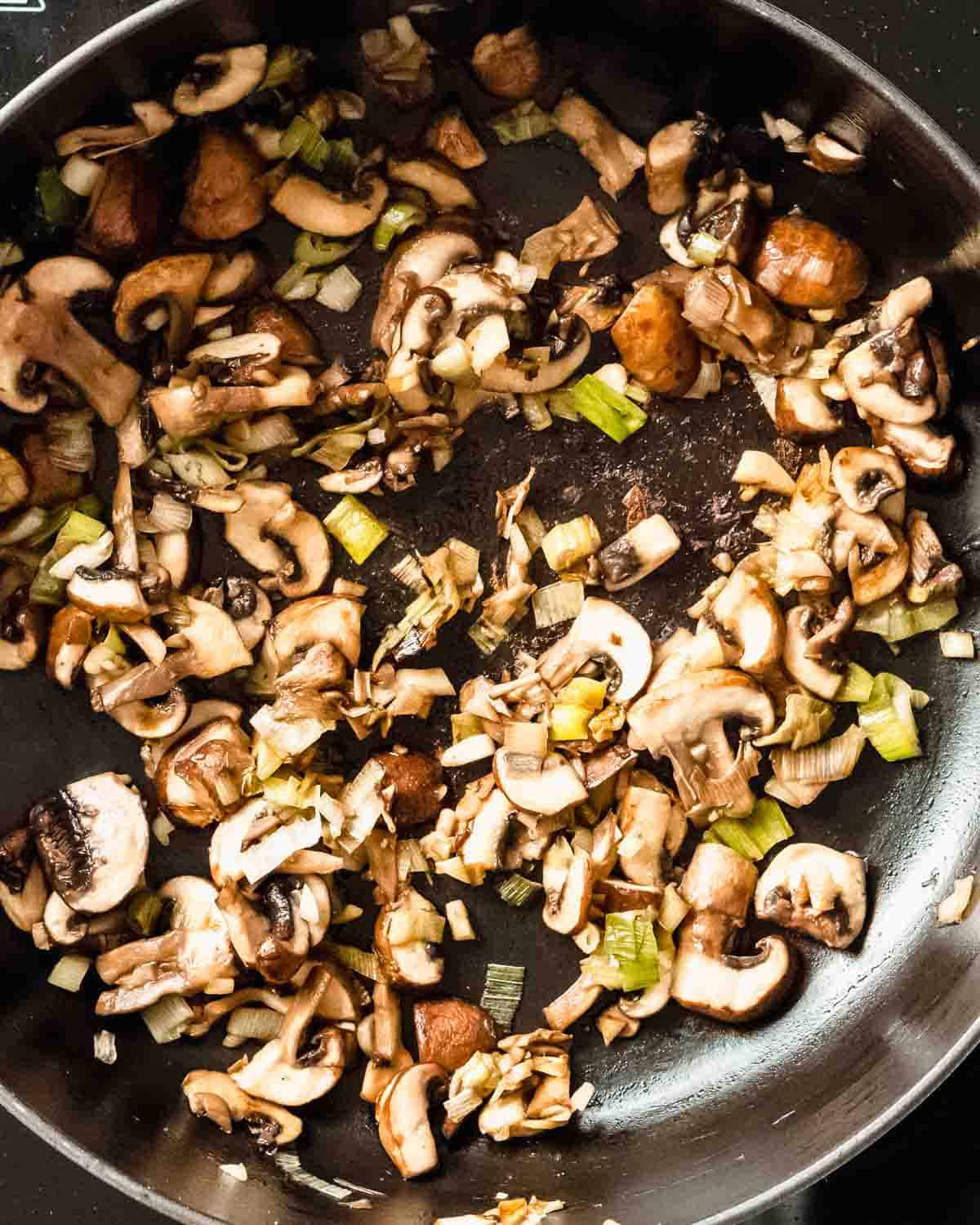 mushrooms sauteed in a pan.