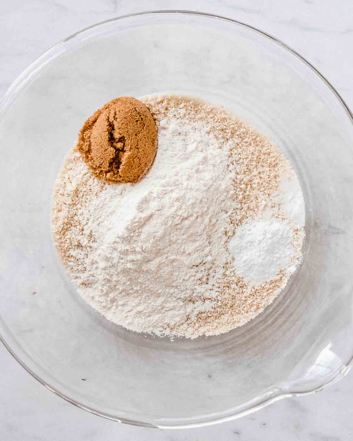 almond flour, baking powder and soda, brown sugar and flour in a mixing bowl.