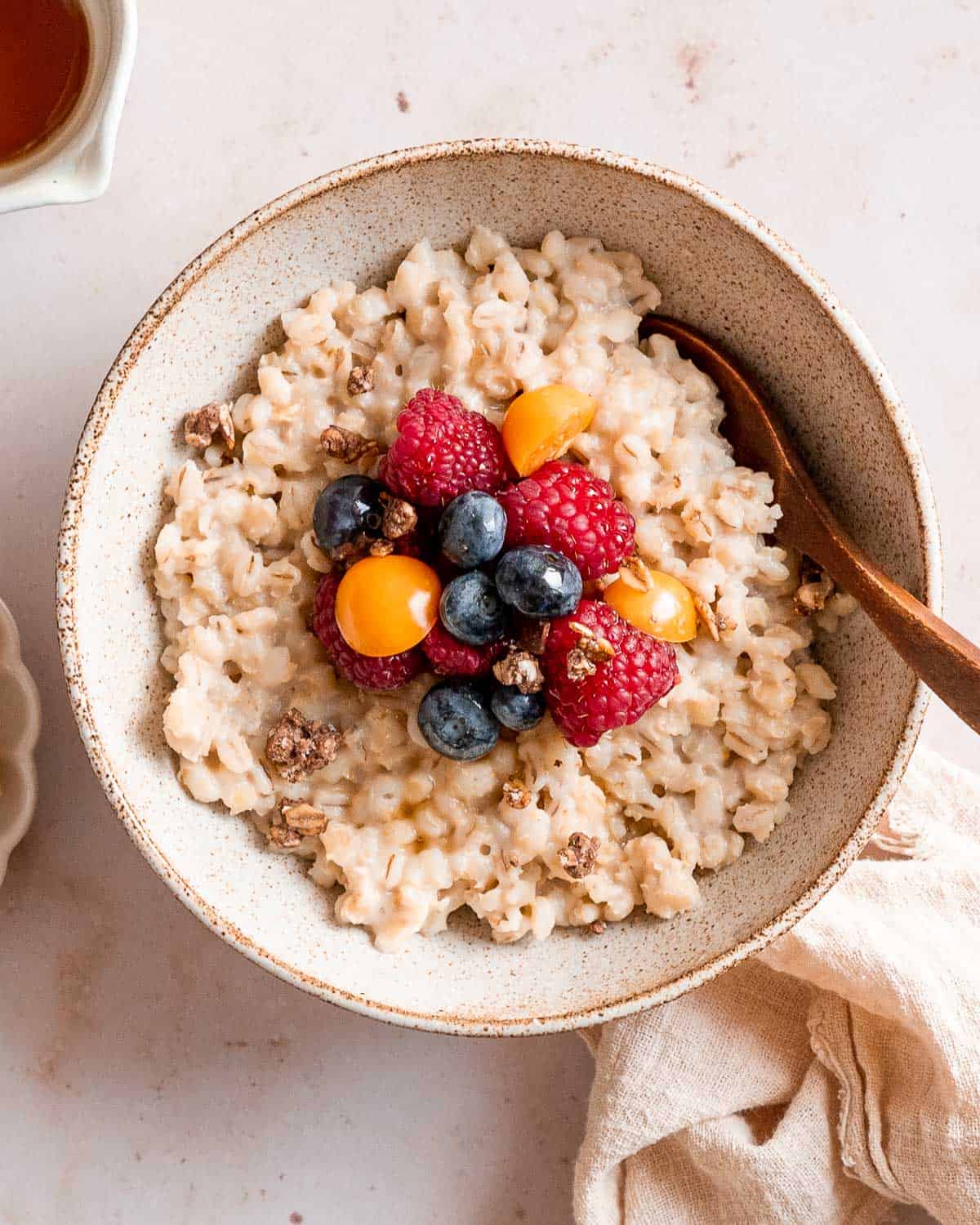 barley porridge made with pearl barley that has not been blended. topped with fresh fruit.