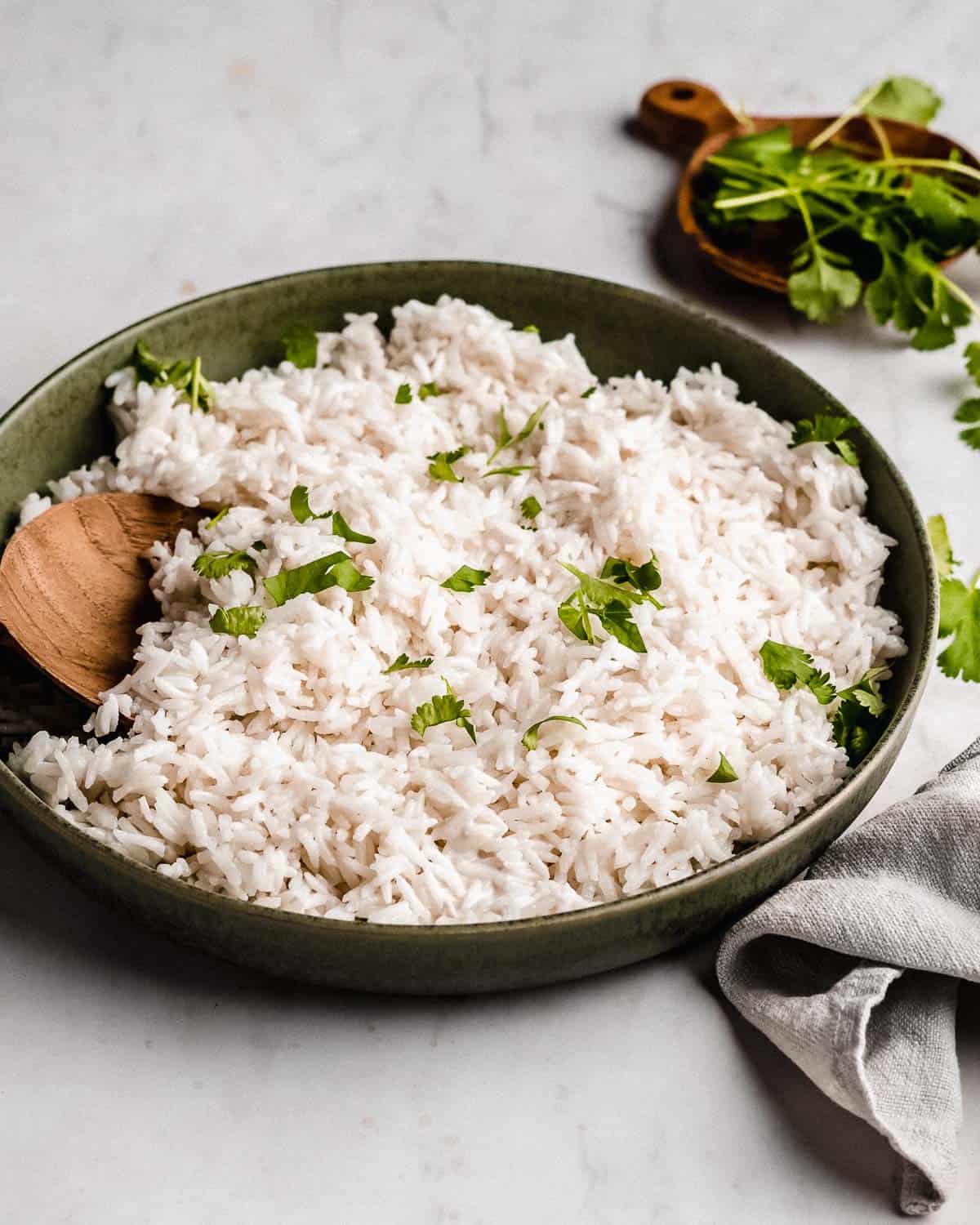 plate of coconut basmati rice topped with fresh cilantro.