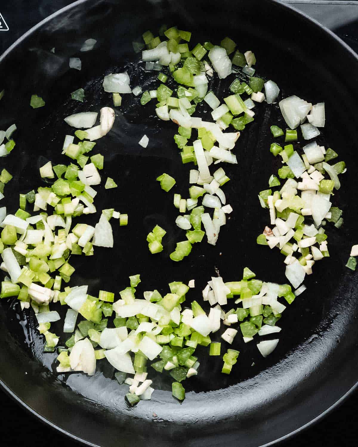 chopped onion, celery, garlic in a saucepan.