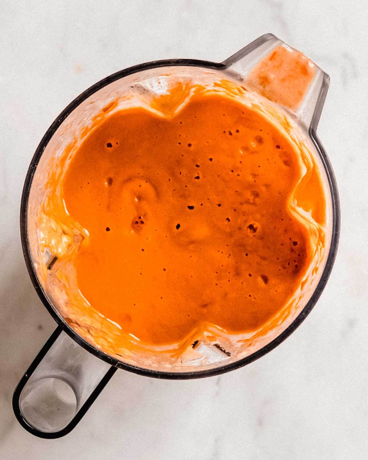 blended cherry tomato soup in a blender.