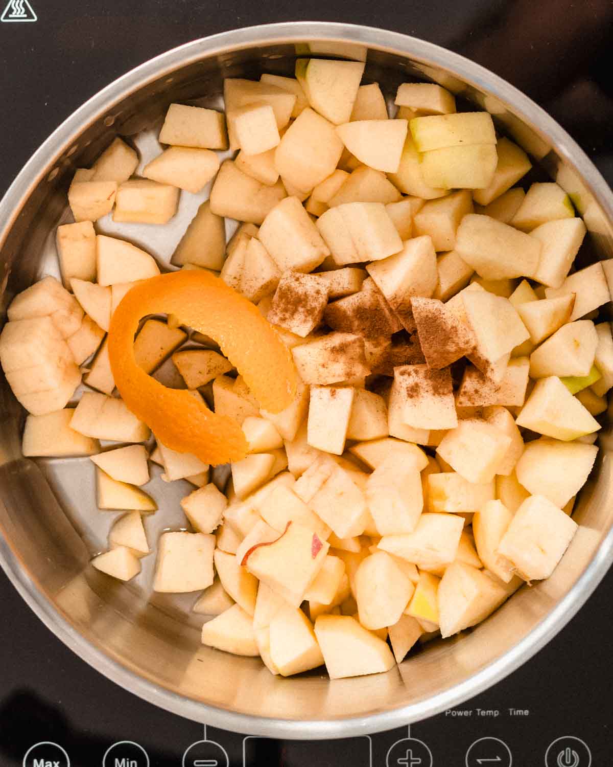 Apple chunks, cinnamon, water, orange peel and lemon juice in a large pot.