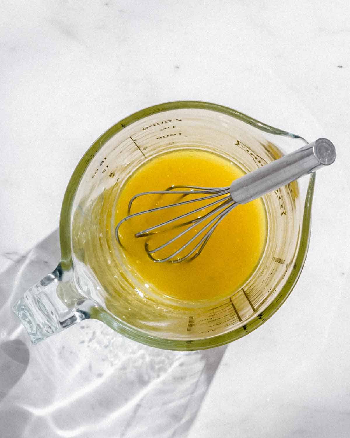 salad sauce in a glass jug.