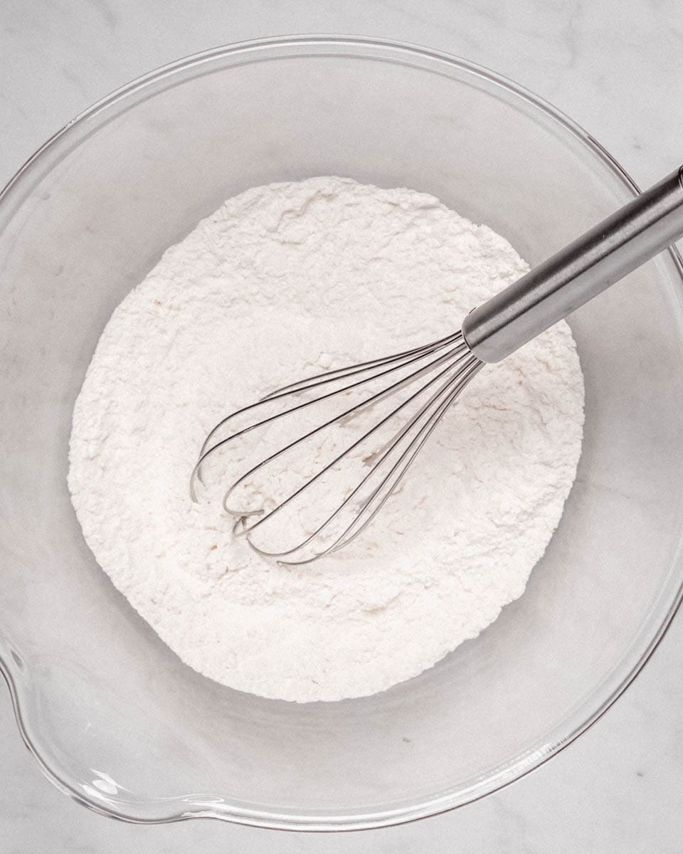 Dry ingredients whisked together in a bowl.