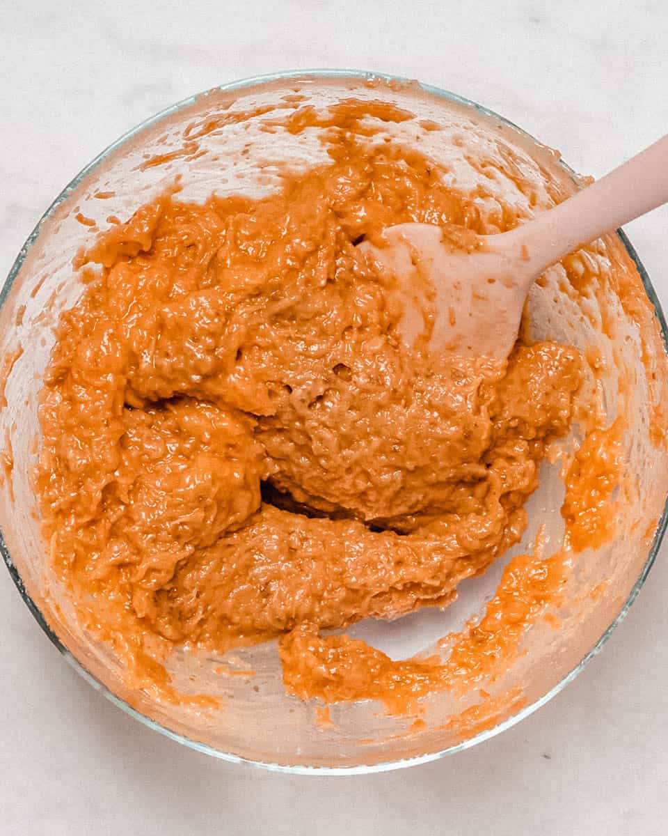 Wet ingredients whisked together in a bowl.