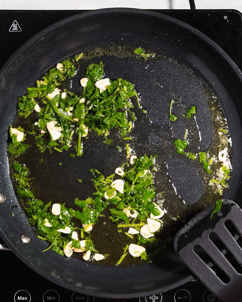 Garlic, parsley fried in a large skillet in olive oil
