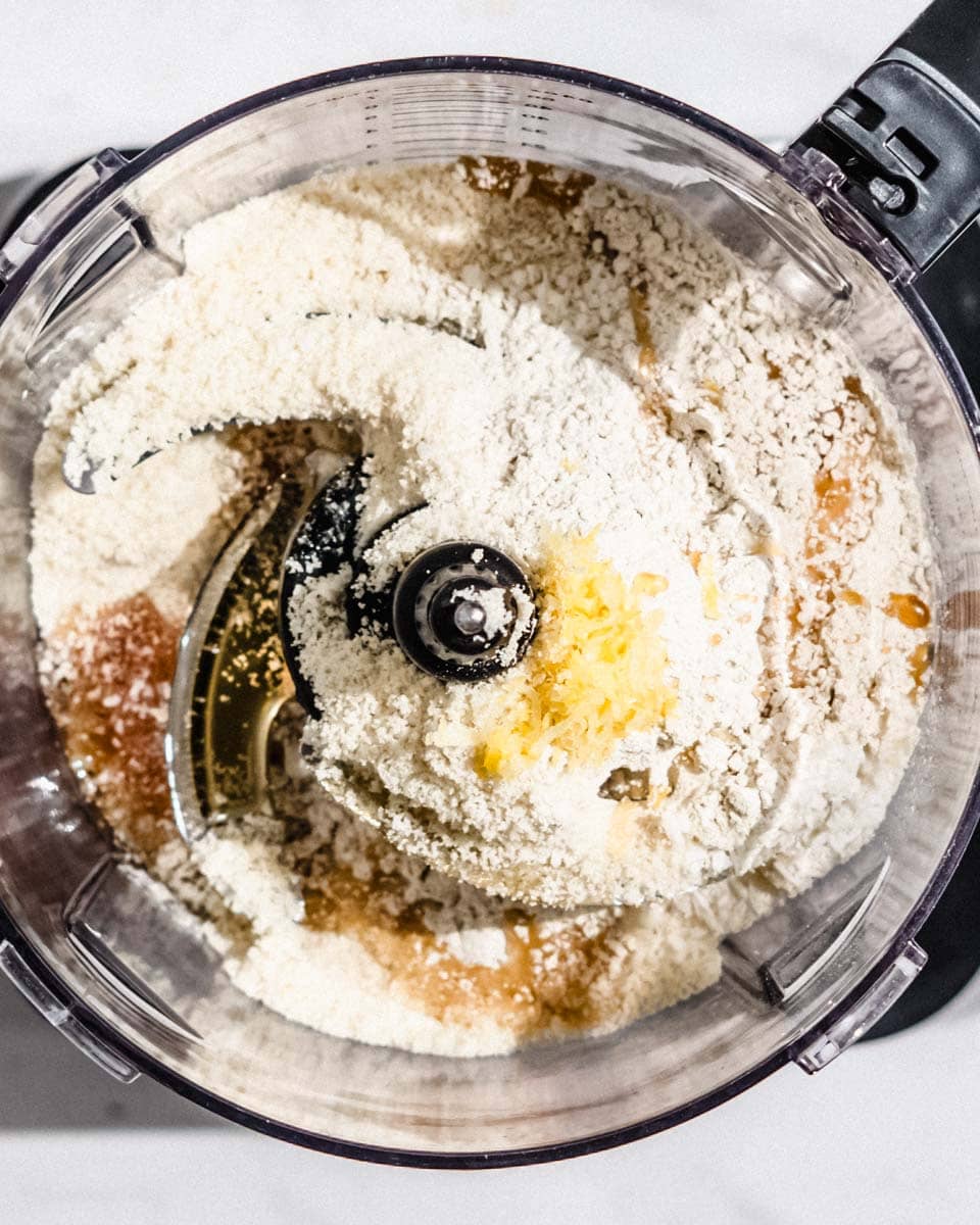 All ingredients needed for these balls added to a food processor.