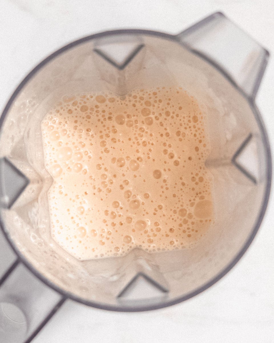 Smoothie blended in a blender jug.