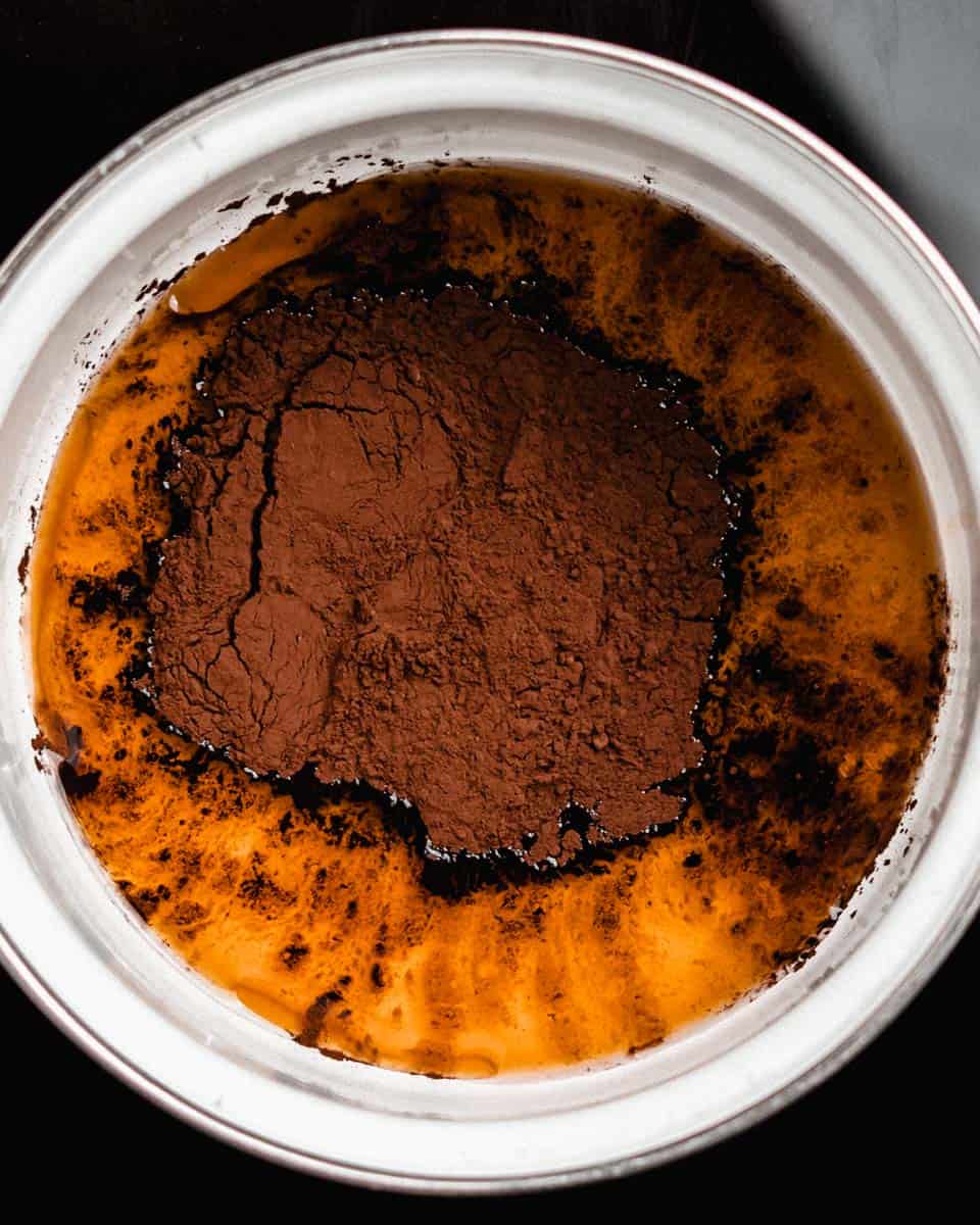 Cocoa powder, maple syrup, coconut oil and vanilla extract in a saucepan.